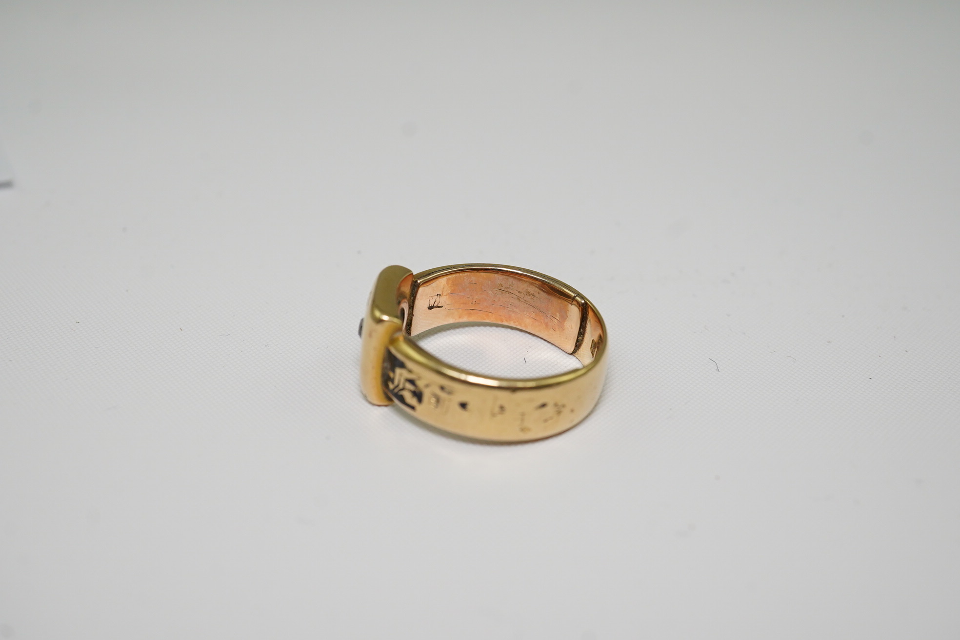 A 19th century 18ct gold, black enamel and single stone diamond set mourning ring